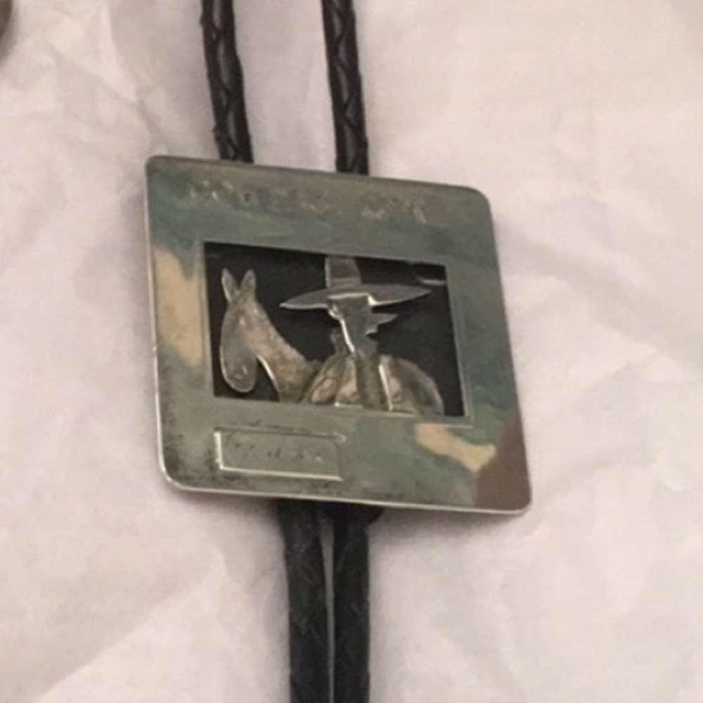 Cowdachrome silver bolo